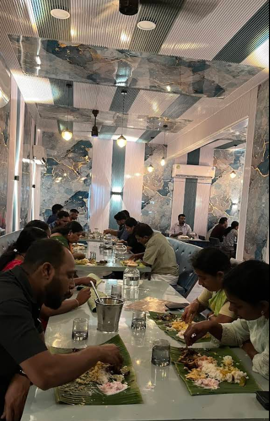 Ishq Restaurant interior with guests enjoying traditional banana leaf meals